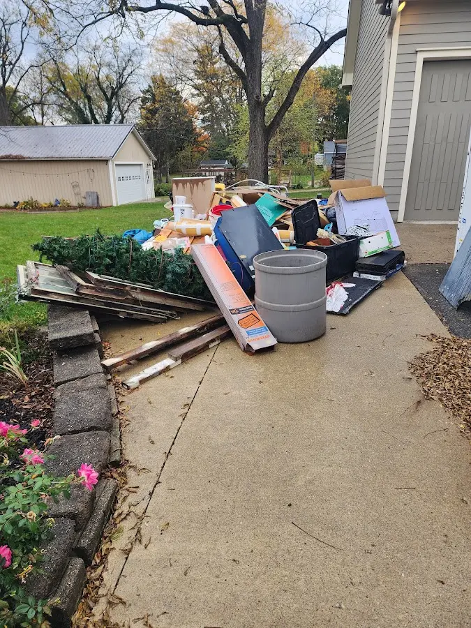 Dumpster being loaded with debris for 10 Yard Dumpster Rental in Leesburg